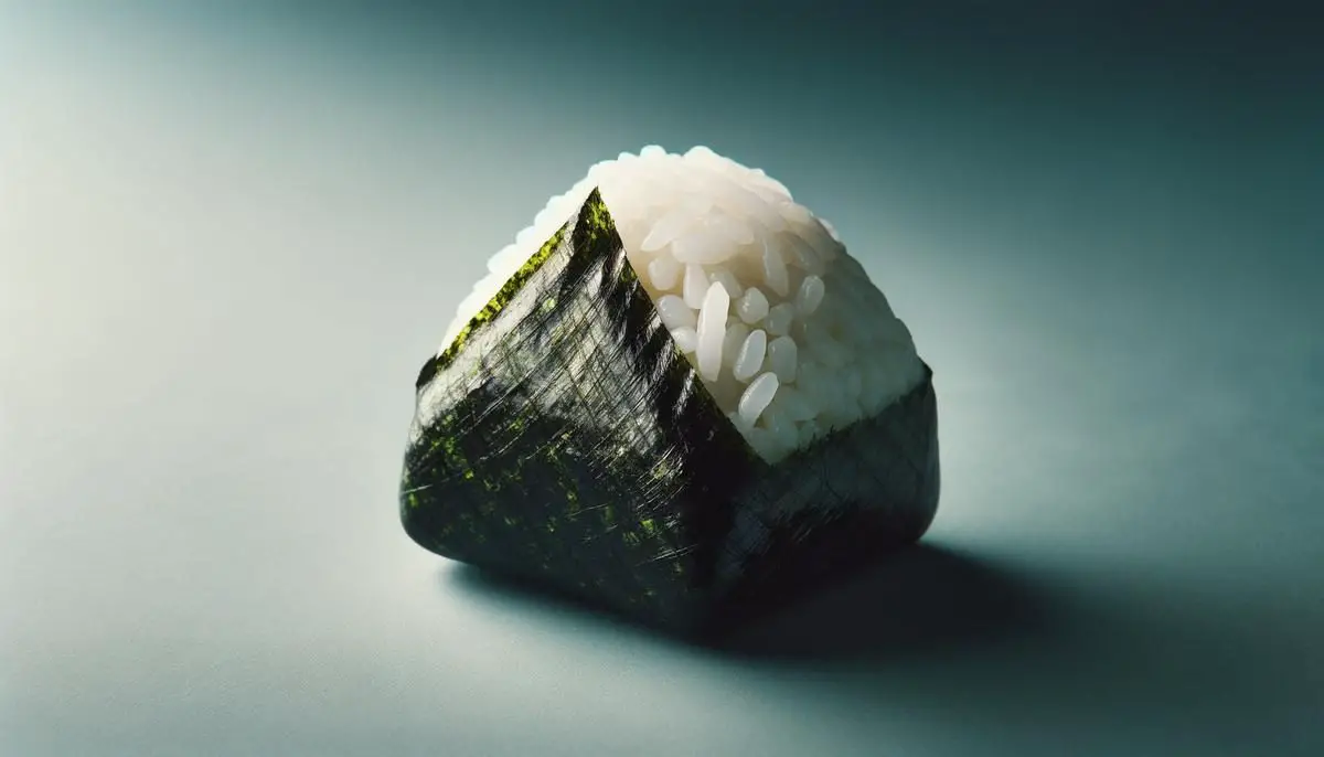 A beautifully shaped onigiri wrapped in seaweed, showcasing the art of shaping this traditional Japanese rice ball